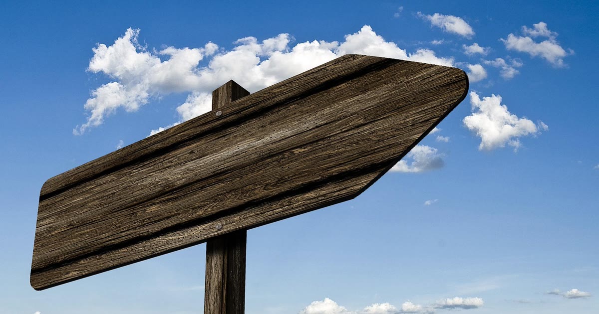 Signpost on a path representing AI agent checkpoints and safe workflow resumption