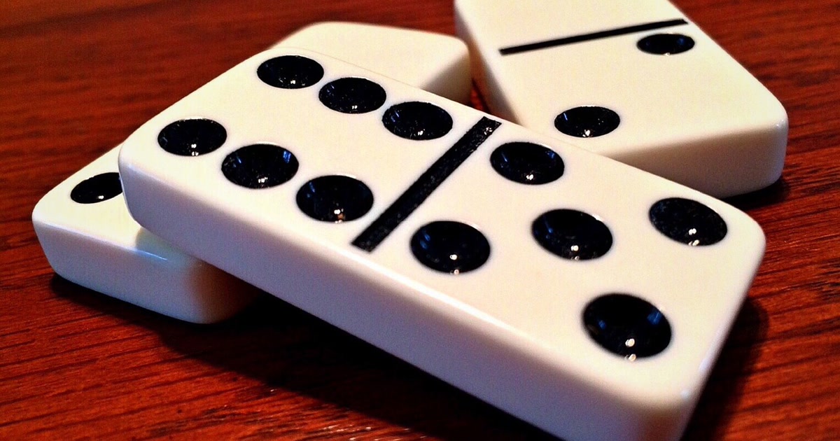 Falling dominoes illustrating compensating actions in AI automation